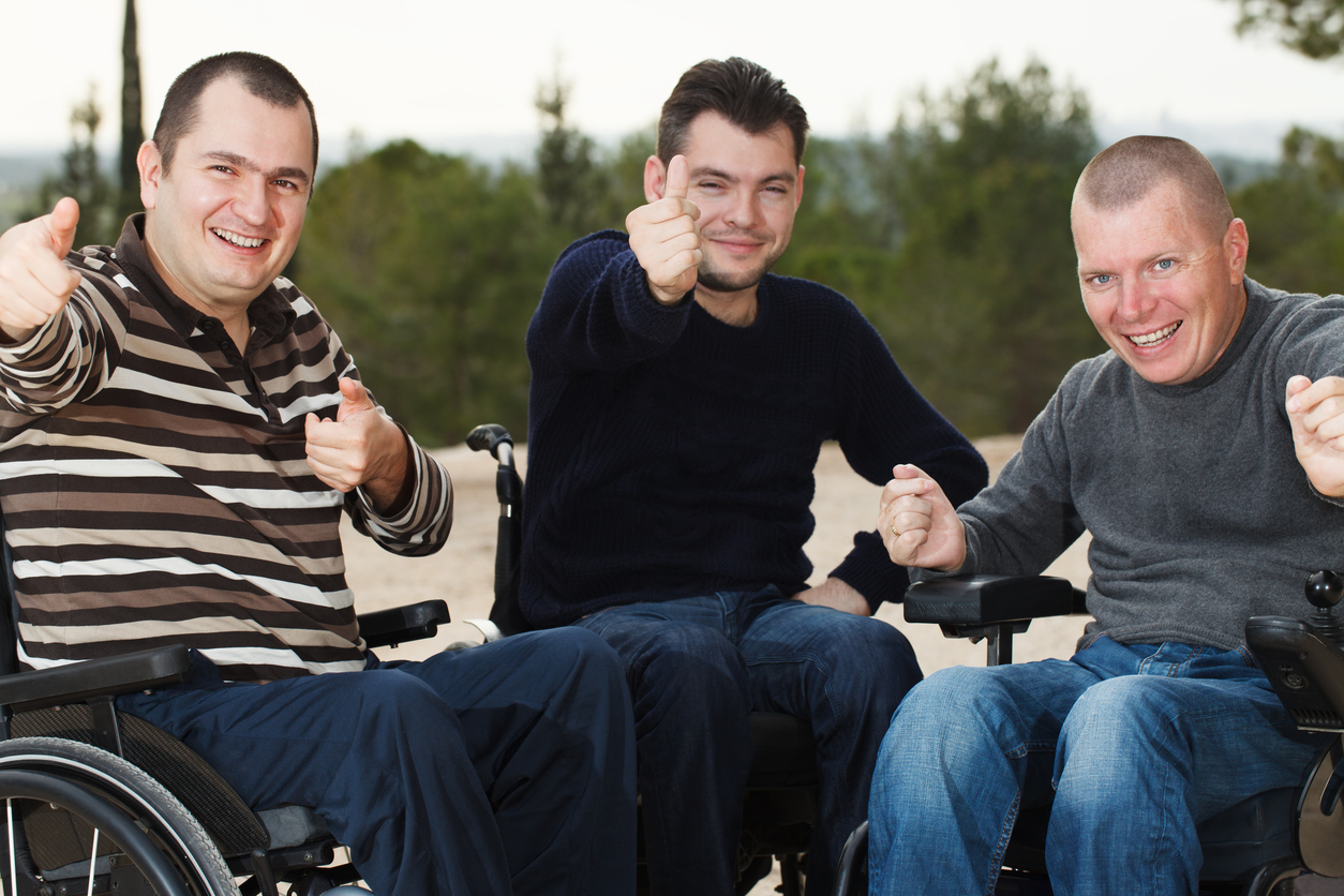Disabled Happy friends with thumbs up.
